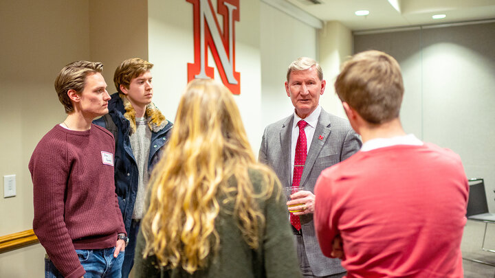 Ted Carter talks with students during a dinner on Jan. 16. The event featured leaders from recognized student organizations, including the Association of Students of the University of Nebraska.